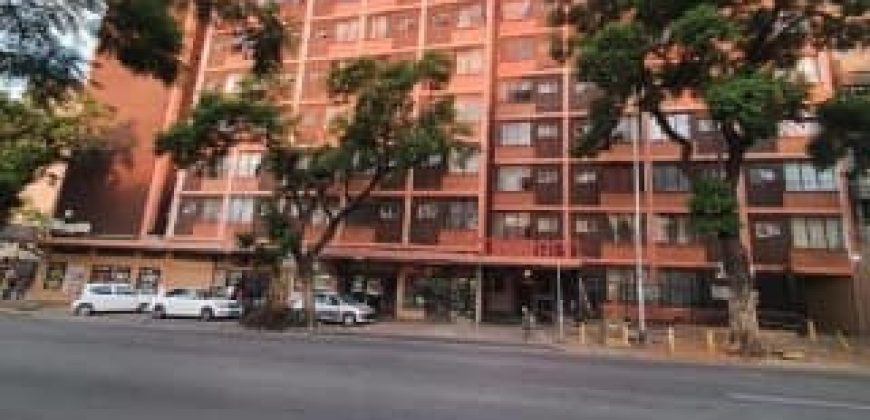 Bachelor apartment for rent in Pretoria Central, featuring a separate bedroom and lounge area. Close to all amenities